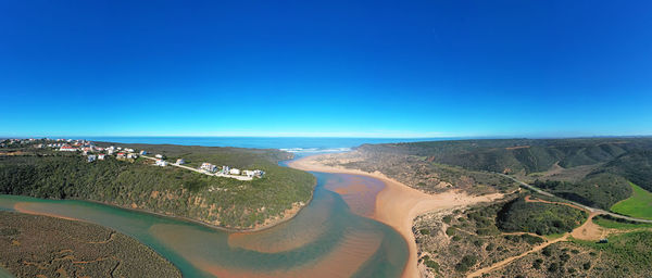 Aerial view of landscape against clear blue sky