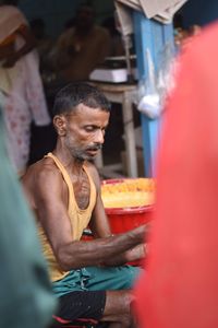 Man holding food at market stall