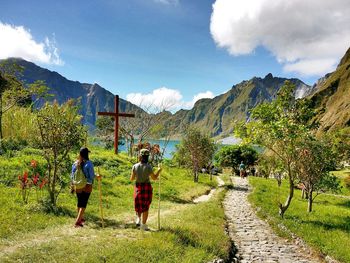 Women walking on countryside landscape