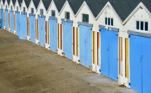 Row of houses on street by building