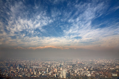 High angle view of city against cloudy sky