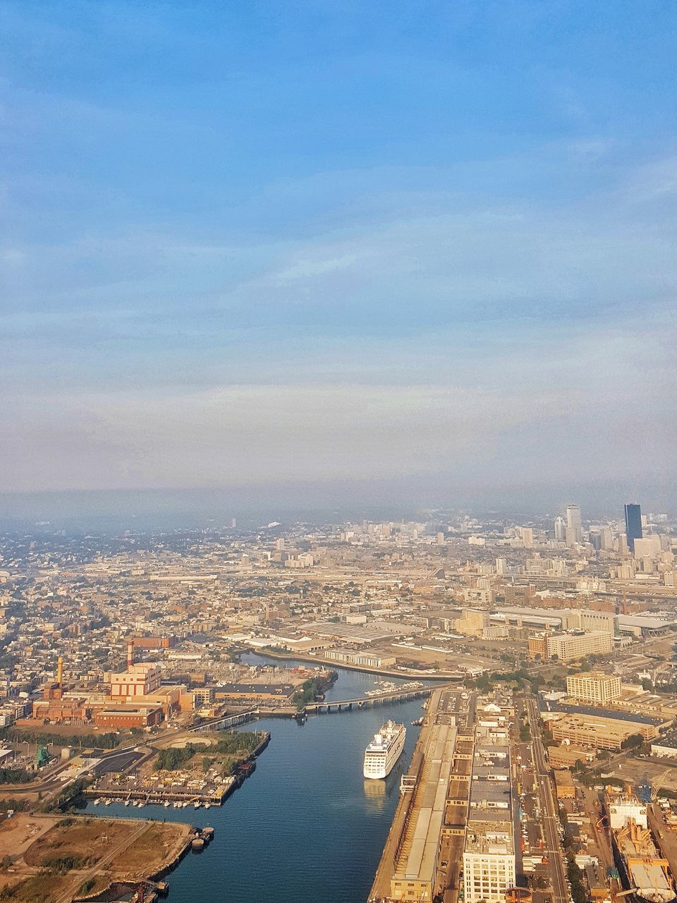 water, high angle view, cityscape, no people, city, sky, aerial view, architecture, built structure, transportation, outdoors, day, building exterior, blue, sea, nature, nautical vessel