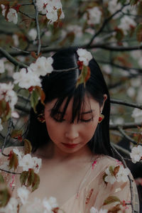 Close-up of young woman looking away