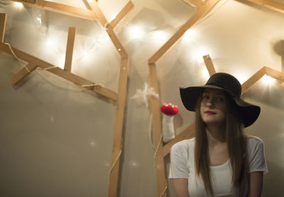 Woman in illuminated room at night