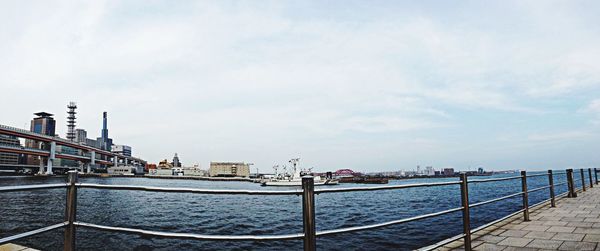 View of bridge against cloudy sky