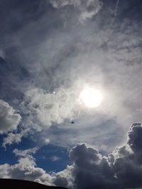 Low angle view of airplane flying in sky