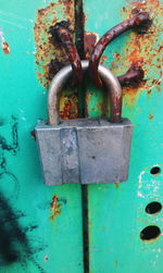 Close-up of padlock on blue door