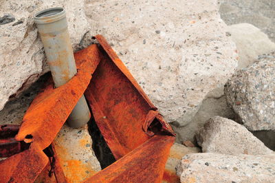 Rusty scrap metal girder on rubble