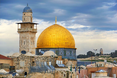 Dome of the rock in city against sky