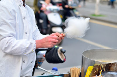 Close-up of man preparing food