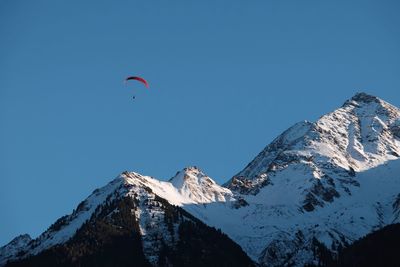 Scenic view of snowcapped mountain against clear blue sky