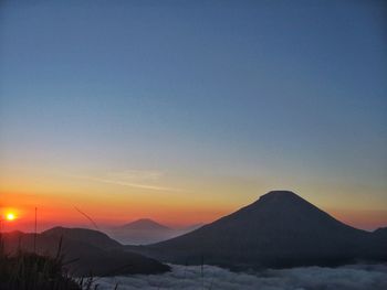 Scenic view of mountains at sunset
