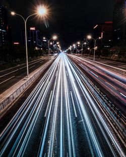 Light trails on city street at night