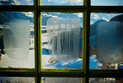 Glass window with condensation during winter