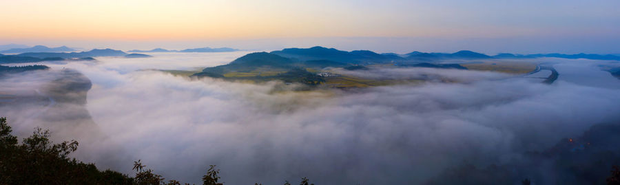 Panoramic view of mountains against sky during sunset