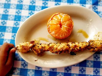 Close-up of hand holding burger