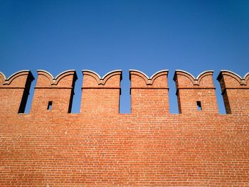 Low angle view of built structure against clear blue sky