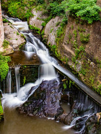 Water flowing through rocks in forest