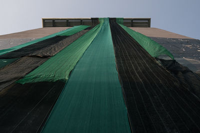 Low angle view of wooden structure against sky