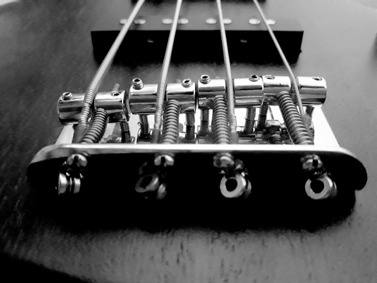 CLOSE-UP OF GUITAR AND TABLE