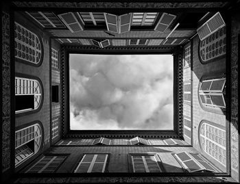 Directly below shot of skylight seen through historic building skylight