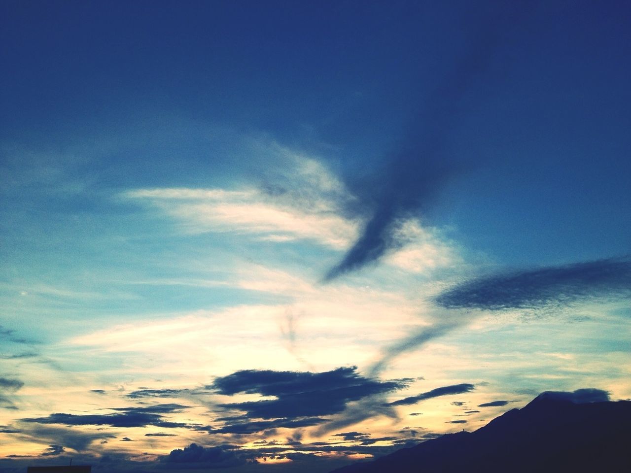 blue, sky, scenics, beauty in nature, tranquility, tranquil scene, cloud - sky, low angle view, nature, cloud, idyllic, cloudscape, mountain, landscape, outdoors, no people, day, majestic, cloudy, sunlight