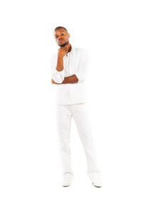 Portrait of man standing against white background