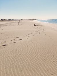 Scenic view of beach against clear sky