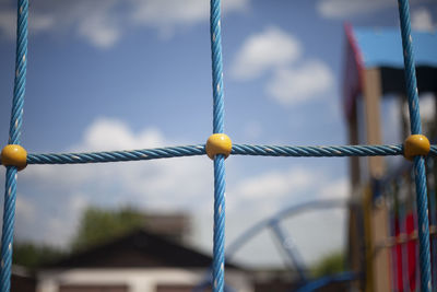 Children's playground in detail. rope ladder in children's area. blue ropes connected in net. 