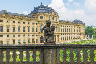 Statue of historic building against sky