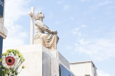 Low angle view of statue against sky