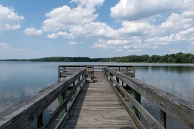 Pier over lake against sky