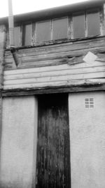 Closed wooden door of house