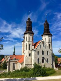 Low angle view of bell tower against blue sky