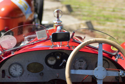 Close-up of red vintage car