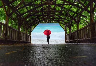 Full length of woman walking on footpath