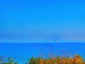 Scenic view of sea against blue sky