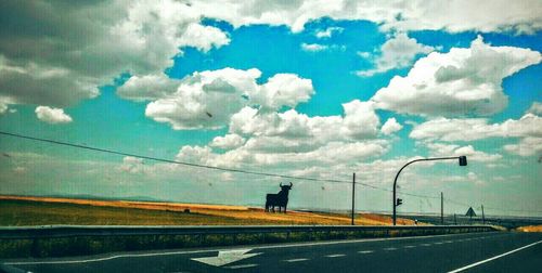 Road against cloudy sky