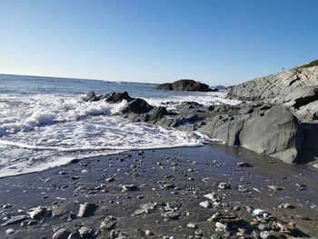 Scenic view of sea against clear sky