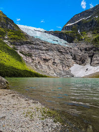 Scenic view of lake and mountains against sky
