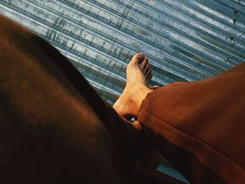 Low section of man lying on floor