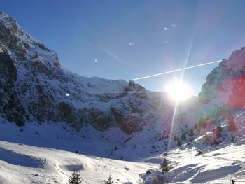 Scenic view of snowcapped mountains against sky