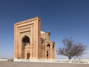 View of historical islamic building against blue sky