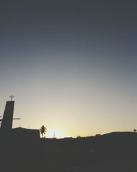 Silhouette landscape against clear sky