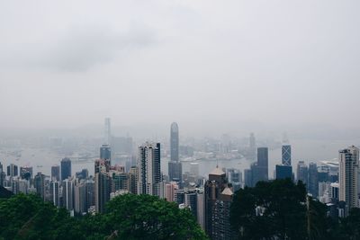 Modern buildings in city against sky