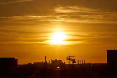 Silhouette of city during sunset