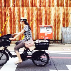 Person riding motorcycle on road