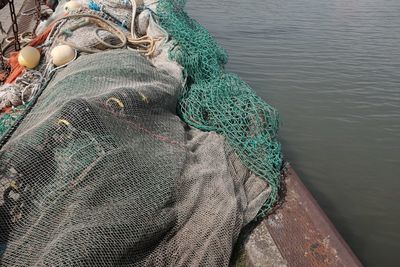 High angle view of fishing net in boat on sea