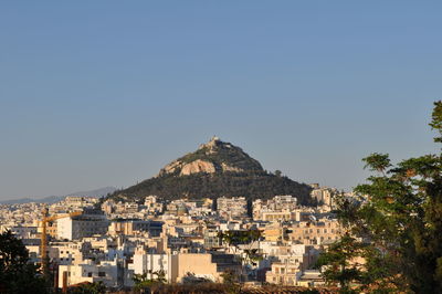 View of cityscape against clear sky