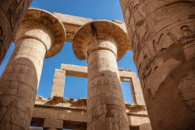 Different columns with hieroglyphs in karnak temple. karnak temple is the largest complex in egypt.